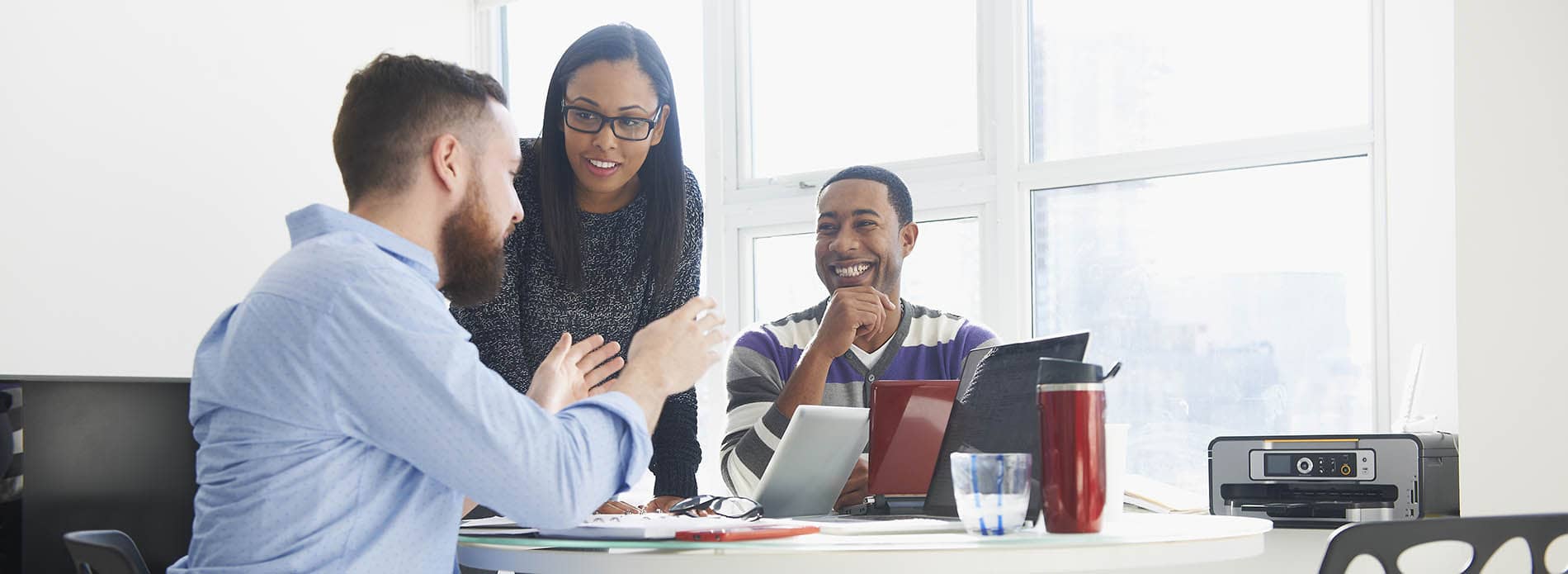 Group of colleagues talking in office